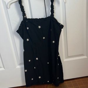 Black dress with daisys on it